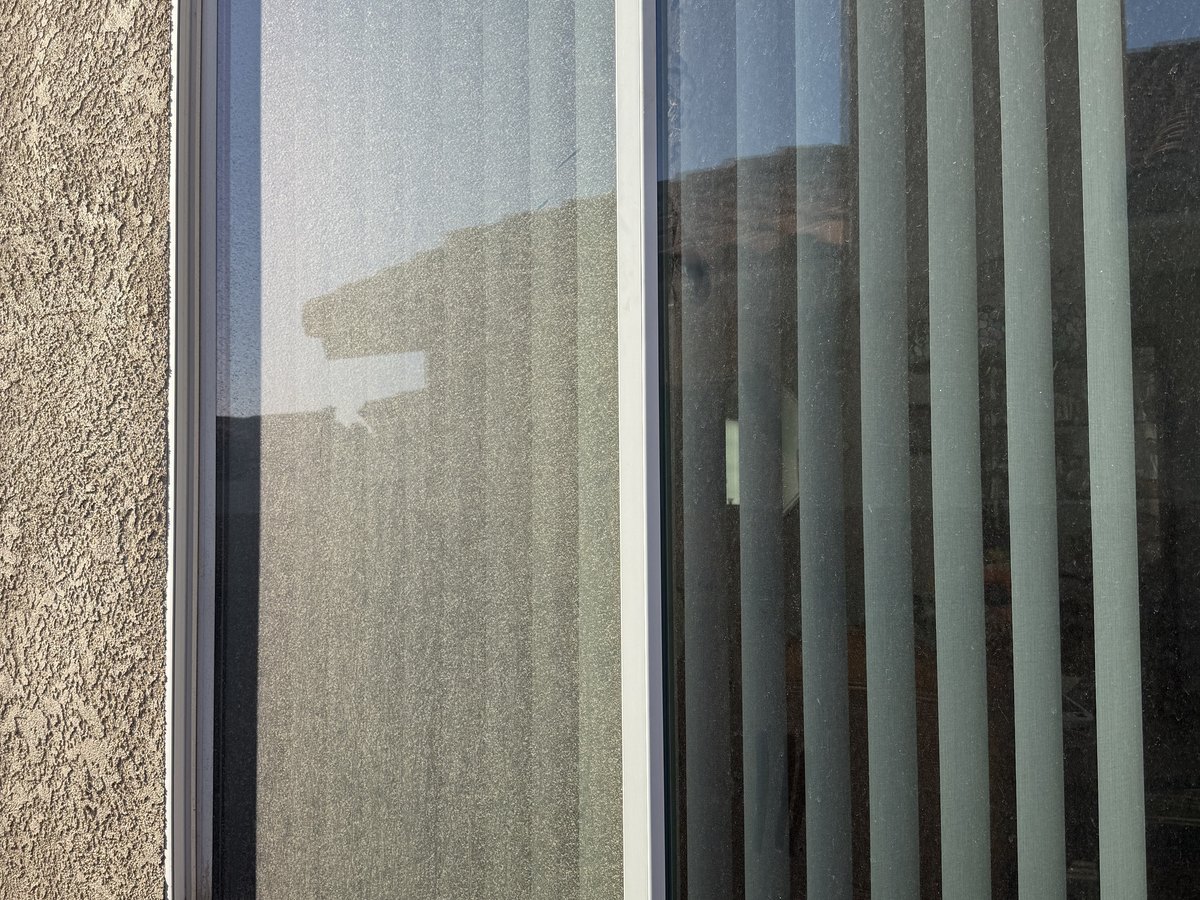 Dusty, streaked window before cleaning