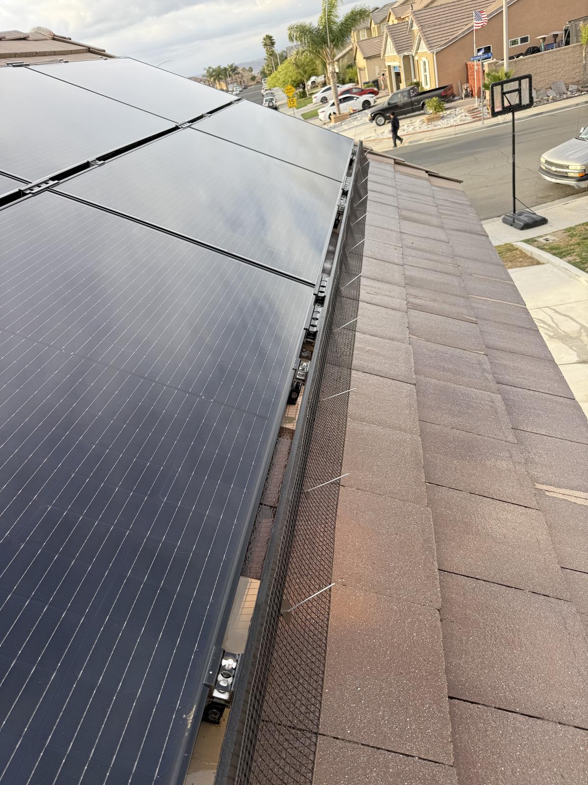 Completed solar panel pigeon proofing on a High Desert home