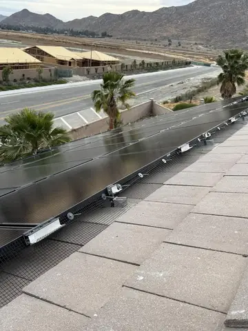 Pigeon mesh running the full edge of a solar array