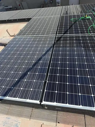 Clean solar array in Phelan with the rinse hose on the roof
