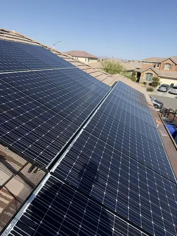 Rows of clean solar panels on a Phelan roof