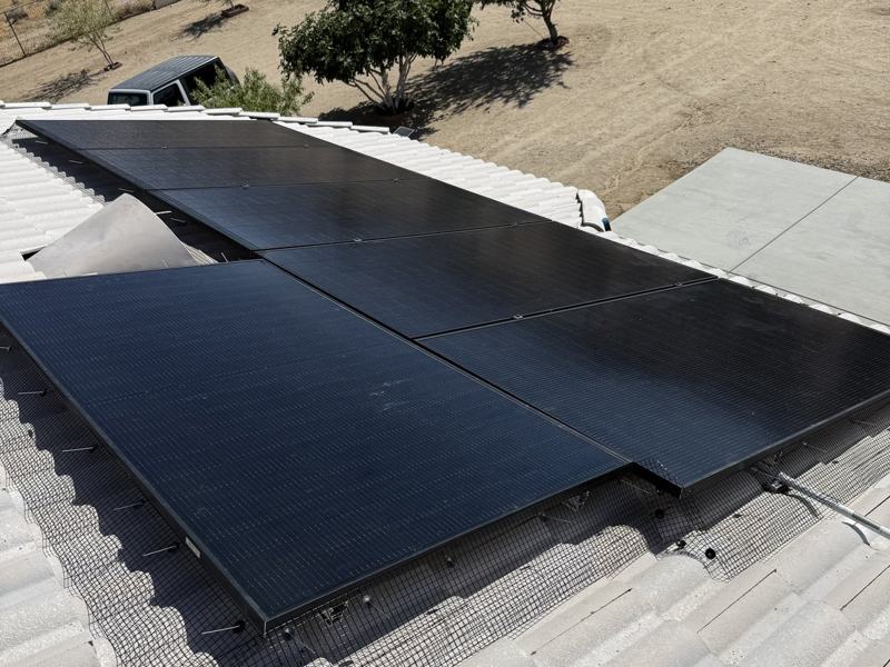 Solar array with mesh clipped along the edge after pigeon proofing